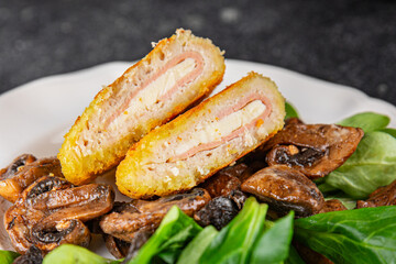 Cordon Bleu Cutlet meat chicken, ham, cheese appetizer dish fresh delicious gourmet food background on the table rustic food top view copy space