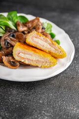 Cordon Bleu Cutlet meat chicken, ham, cheese appetizer dish fresh delicious gourmet food background on the table rustic food top view copy space