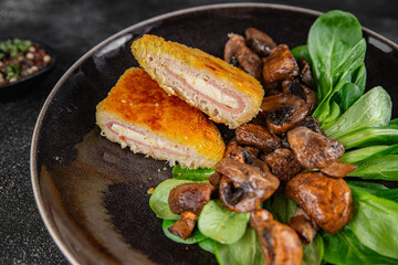 Cordon Bleu Cutlet meat chicken, ham, cheese appetizer dish fresh delicious gourmet food background on the table rustic food top view copy space
