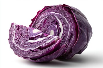 Fototapeta premium A vibrant close-up of a sliced red cabbage, revealing its intricate layers and textures on a white background, showcasing freshness and natural patterns.