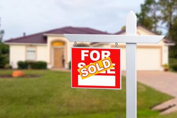 Sold Home For Sale Sign in Front of New House.