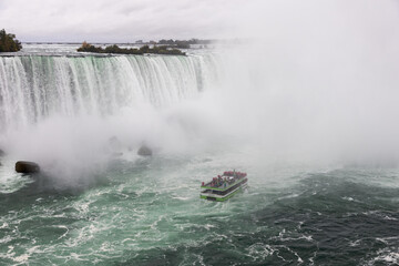 Niagara falls with cruise ship near Horseshoe fall in Canada