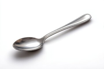 Shiny metal spoon angled isolated on white background