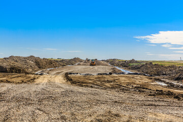 Dirt road with a large truck on it