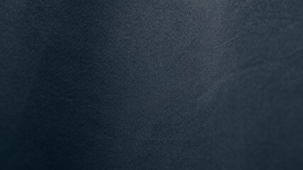 A background image featuring vertical folds of fabric. The matte texture and shadows highlight fine...