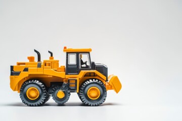 Fototapeta premium Yellow Toy Bulldozer: A Minimalist Construction Vehicle Study