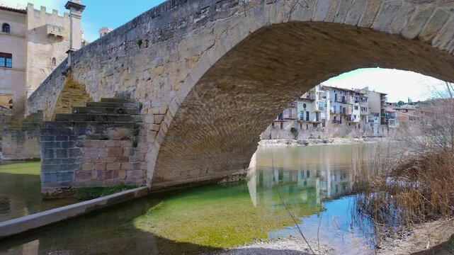 Medieval stone bridge across the river that passes by the medieval town of Valderrobres, Teruel, Spain.