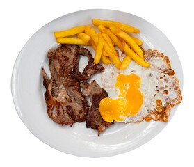 Cooked tender veal with fried egg and French fries. Serving a Spanish meat dish on a white plate. Isolated over white background