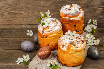 Easter cake Cruffin or sweet bread kulich with painted eggs. Traditional festive baking