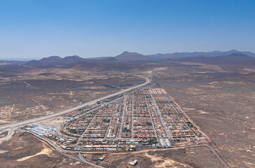 Stunning high level aerial panoramic landscape image of the village of La Capellania, Tamaragua, Corralejo, Fuerteventura, Canary Islands, Spain