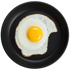 A fried egg in a skillet with a bite taken out of it isolated on white background