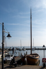 Tourists destination in North Holland, old authentic fishermen village Volendam near Amsterdam with old houses and narrow streets