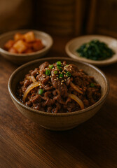 Traditional korean bulgogi beef in ceramic bowl with sesame and green onion