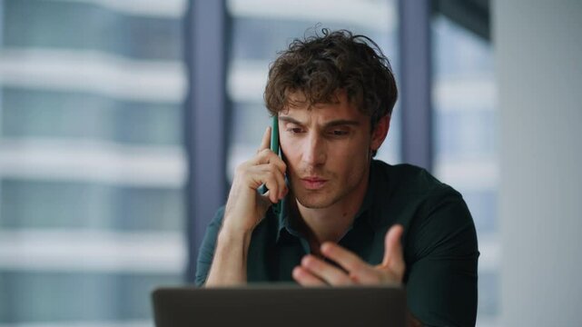Worried boss speaking cellphone feeling tension at corporate workplace closeup.