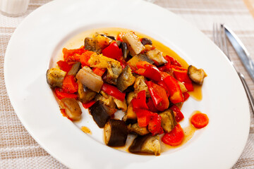 Dish with stewed vegetables and pepper. High quality photo