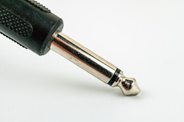A close-up image of a versatile silver drill bit, ready for action against a white backdrop that gradually fades to gray