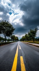 Empty road under a stormy sky