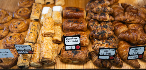 View of glass display full of various appetizing confectioneries in pastry shop