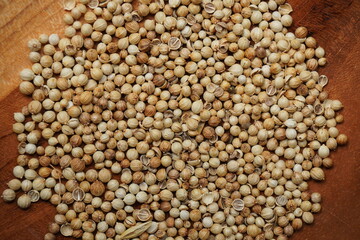 coriander seeds in a wooden bowl