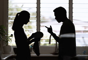 unhappy woman, aggressive man quarreling at home. Angry husband emotionally arguing screaming...