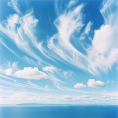 Tranquil Blue Sky: Panoramic Aerial View of Fluffy Cumulus Clouds over Serene Coastal Horizon