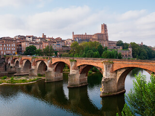 Fototapeta premium Picturesque landscape with a view of the ancient bridge over the Tarn River in the city of Albi, France