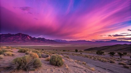 Fototapeta premium Vibrant sunset over mountains with colorful skies and desert landscape.