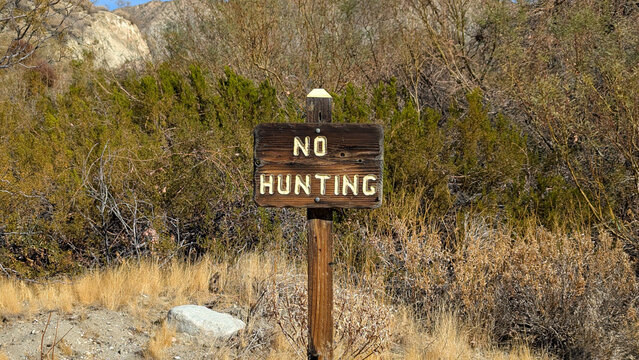 No hunting sign wood post