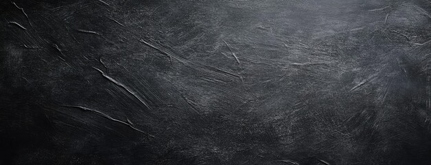 A smooth. blank chalkboard surface in a classroom setting. ready for teaching. with natural light illuminating the area and educational materials in the background