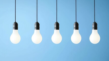Five hanging lightbulbs, blue background, studio shot, idea concept