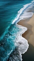 Coastal waves meeting sandy shore