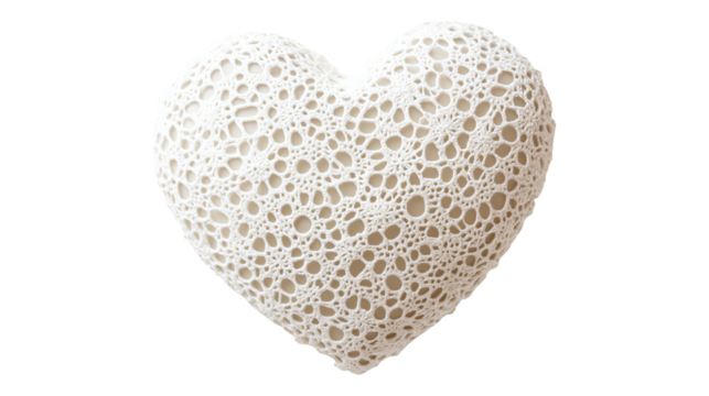 a white heart shaped object with a lacy pattern