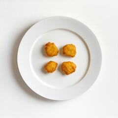 Four Golden Fried Food Balls on White Plate