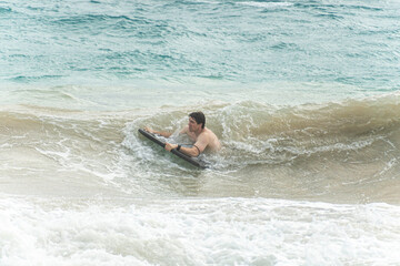 boogie boarding at Poipu beach 