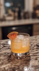 Home-made grapefruit cocktail on kitchen counter