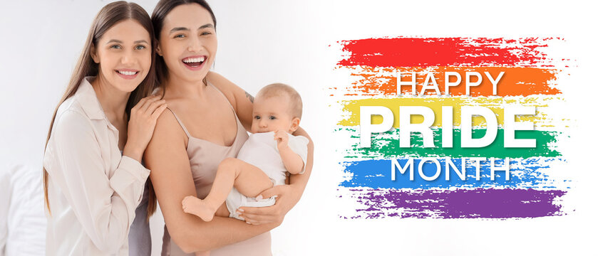 Young lesbian couple with their little baby in bedroom