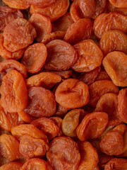 dried apricot fruits, dried apricots, fill the frame entirely in close-up.