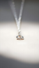 necklace with a heart shaped pendant hanging from it