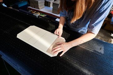 Manual cardboard application at a box manufacturing plant enhances efficiency and craftsmanship in everyday packaging solutions