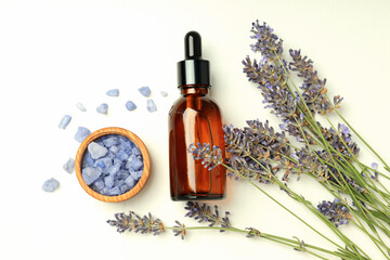 Plakat Serum bottle, lavender and sea salt on white background, top view