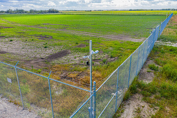 Fence surrounds a field of grass