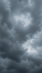 Obraz premium Dark stormy clouds dramatically fill the frame with moody grey hues. AI Generated
