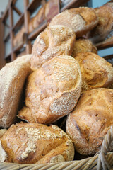 Freshly baked bread piled in a rustic bakery display
