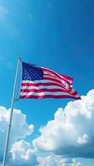 Fototapeta premium Stars and Stripes billow against a vibrant blue sky dotted with fluffy white clouds , color, liberty, illustration