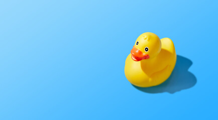 Adorably Cute Yellow Rubber Duck Floating on Blue Background