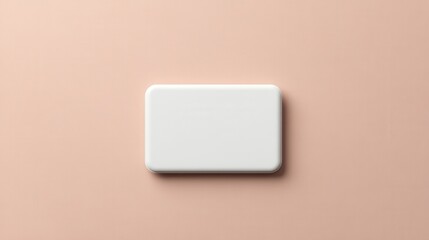 Blank white rectangular button on a peach background