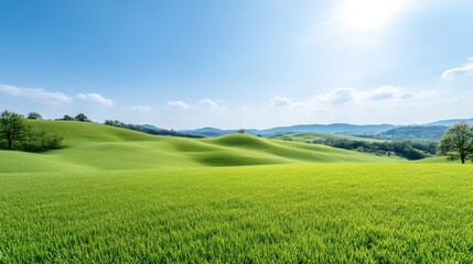 Fototapeta premium Lush green landscape stretches under a vibrant blue sky, rolling hills