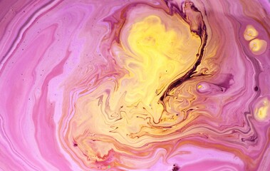 Abstract yellow-pink background. The acrylic paint flows and mixes freely, creating a whimsical...