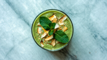 a green smoothie bowl full of soup 