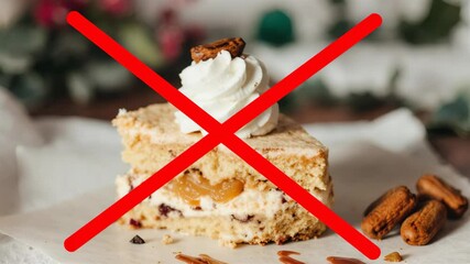 Sliced cake with a warning symbol to eat less sugar  